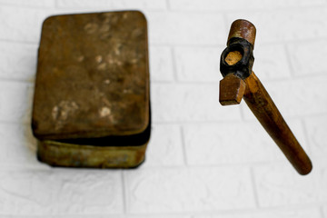 Floating hammer with toolbox in backdrop