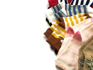 Fototapeta na wymiar Set of socks isolated on a white background. Composition of multi-colored socks. Children's socks. Socks background.