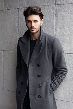 Young handsome man in coat