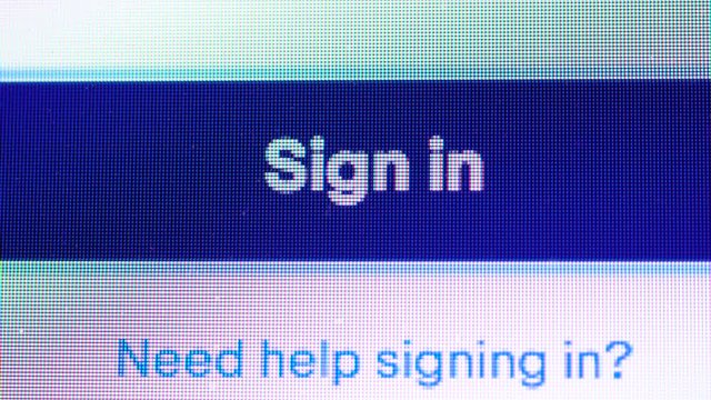 Close up Shot of Mouse Cursor Clicking " Sign in " Button .