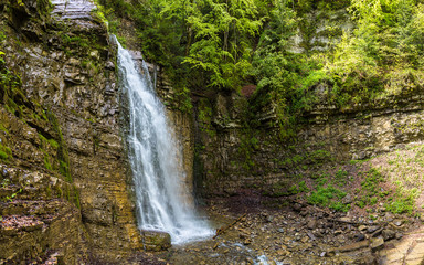 Fototapeta na wymiar Waterfall in Carpathian mountain