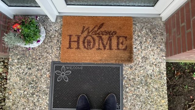 Male Person With Chelsea Boots Entering Welcome Home Door,top Down Shot