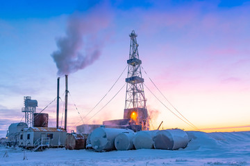 Fototapeta premium Winter polar day in the arctic. Drilling a well at a northern oil and gas field. Low sun. Beautiful lighting.