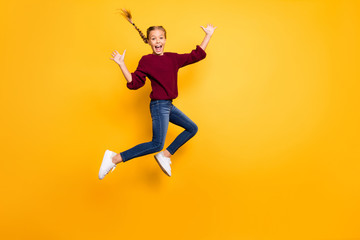 Full length body size view of her she nice attractive lovely crazy overjoyed glad girlish cheerful pre-teen girl jumping having fun isolated on bright vivid shine vibrant yellow color background