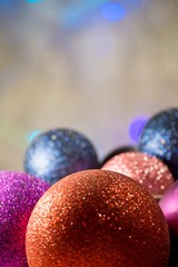 Christmas background with shiny colored toys.