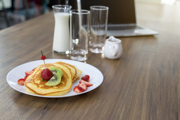 Close up of a strawberry pie on a wooden table