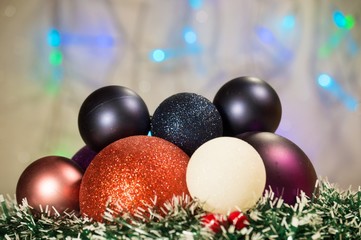 Christmas background with shiny colored toys.