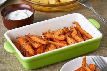 Baked carrots with dill seeds in a ceramic form