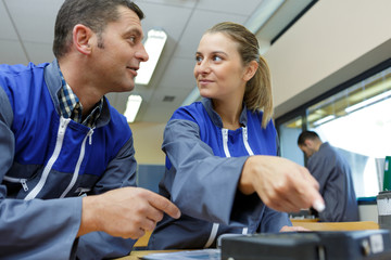 portrait of blue collar workers discussing something