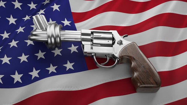 Silver revolver with wooden grip over waving American flag