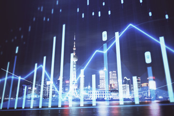 Naklejka premium Financial graph on night city scape with tall buildings background multi exposure. Analysis concept.