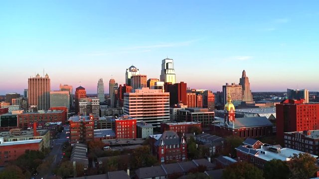 Golden Hour Sunset on Kansas City Skyline Rising Up with Drone