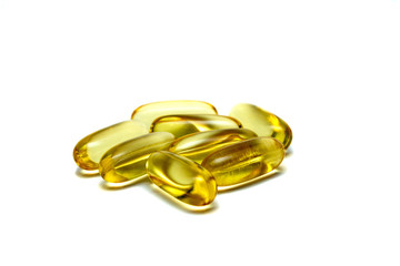 Vitamin e omega 3 fish oil yellow pills vitamins sport nutrition healthy on the white background...