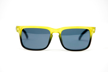 Blue and yellow sunglasses isolated over the white background