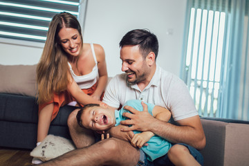 Young family being playful at home