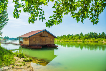 Floating wooden cabin on the river Drava in town of Donja Dubrava, Medjimurje region of Croatia