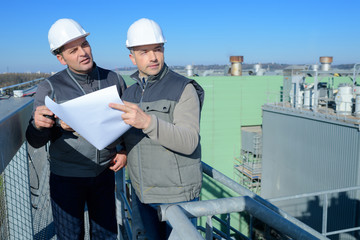 portrait of engineers checking the site