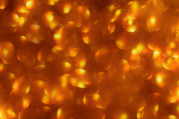 Golden brown yellow bokeh background. Concept for New Year, Christmas and All Celebrations.