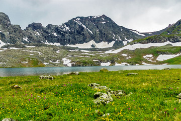 large cold lake high in the caucasus mountains