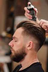 Client visiting hairstylist in barbershop. hair styling