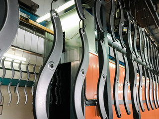 Powder coating line. Industrial interior. Workshop equipped with conveyors.