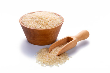 Steamed rice in a wooden scoop and in a bowl isolated on white background