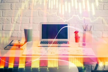 Forex market chart hologram and personal computer background. Double exposure. Concept of investment.