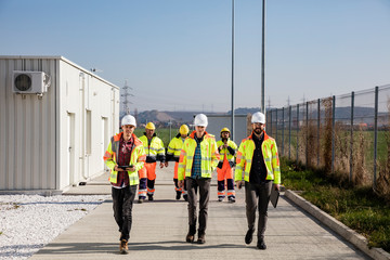 Engineers and workers walking