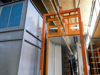 Powder coating of metal parts in factory