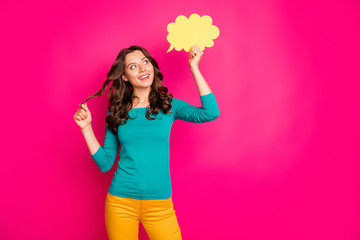 Photo of cheerful positive wavy cute nice pretty sweet white girlfriend wearing yellow pants trousers smiling toothily holding bubble of thoughts isolated vivid fuchsia color background