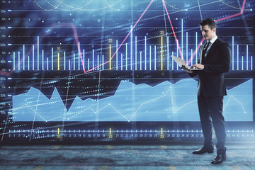 Obraz premium Businessman and forex graph hologram. Double exposure. Concept of financial education and analysis