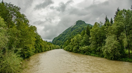 muddy river among trees and hills