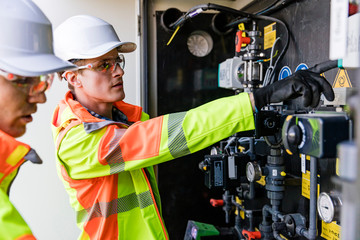 Engineers checking  measuring devices
