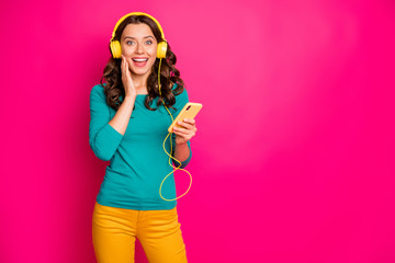 Photo of curly wavy cheerful positive nice pretty cute charming gorgeous girlfriend expressing amazement on face holding telephone isolated pink vivid color background