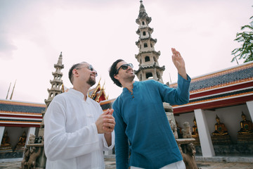 Male tourists in a Buddhist temple.