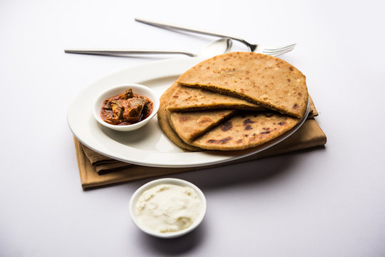Sattu Ka Paratha / Stuffed Channa Dal Flour Paratha served with mango pickle and curd or dahi
