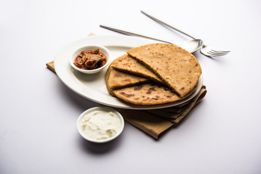 Sattu Ka Paratha / Stuffed Channa Dal Flour Paratha served with mango pickle and curd or dahi