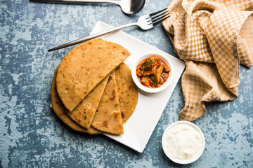 Sattu Ka Paratha / Stuffed Channa Dal Flour Paratha served with mango pickle and curd or dahi