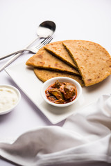 Sattu Ka Paratha / Stuffed Channa Dal Flour Paratha served with mango pickle and curd or dahi