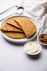 Sattu Ka Paratha / Stuffed Channa Dal Flour Paratha served with mango pickle and curd or dahi
