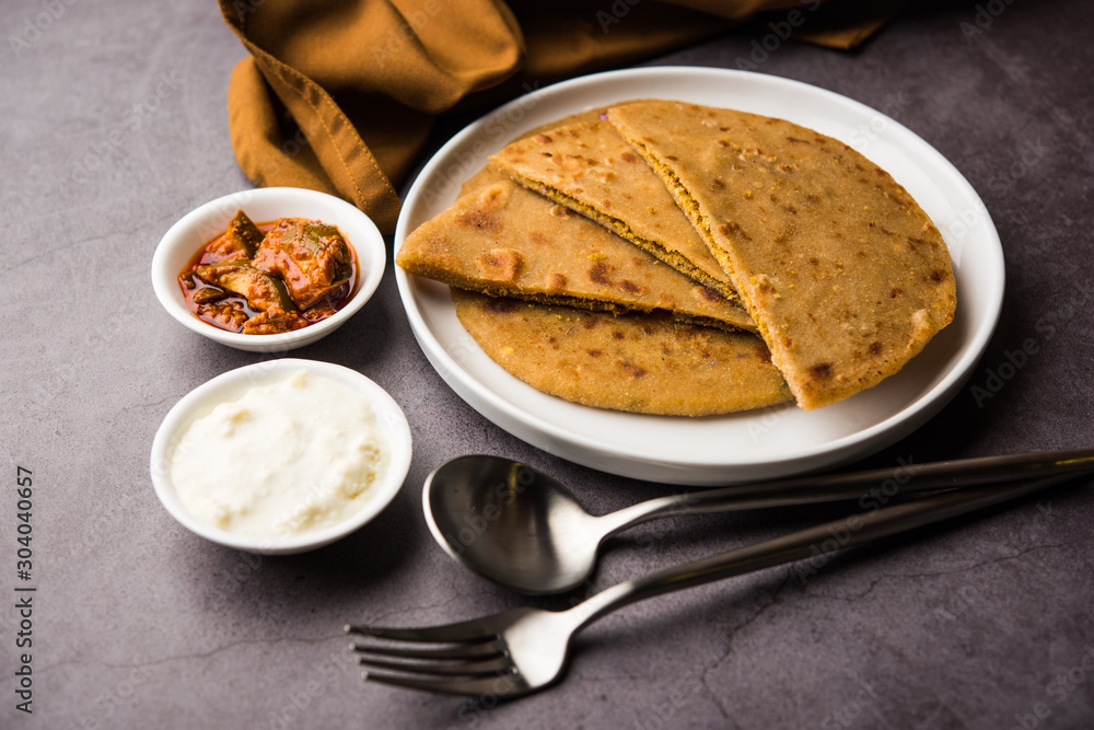 Wall mural Sattu Ka Paratha / Stuffed Channa Dal Flour Paratha served with mango pickle and curd or dahi