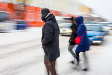 Busy city people on zebra crossing in motion blur