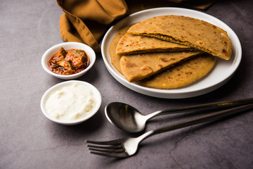 Sattu Ka Paratha / Stuffed Channa Dal Flour Paratha served with mango pickle and curd or dahi