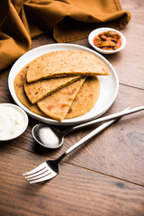Sattu Ka Paratha / Stuffed Channa Dal Flour Paratha served with mango pickle and curd or dahi