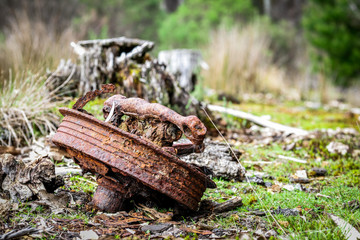 Rusty Car Brake Drum in remote Tasmanian Tarkine Forest 