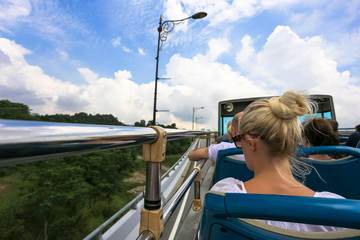 Open bus top view of tourist activity on double decker bus and motion blur