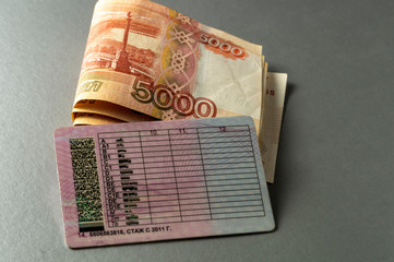 Russian driver's license and Russian cash close up