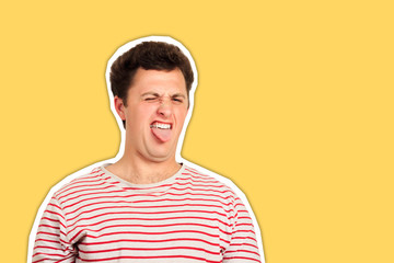 a young man looking shocked and frightened pull out his tongue in disgust. emotional man isolated Magazine collage style with trendy color