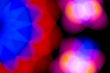 Defocused of photo bokeh blurred circle light from colorful neon lighting bulb in the night for abstract background texture pattern