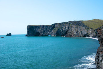 The Dyrholaey Peninsula in the south of Iceland. View of black sand beach near of the small town Vík. Iceland, Europe.